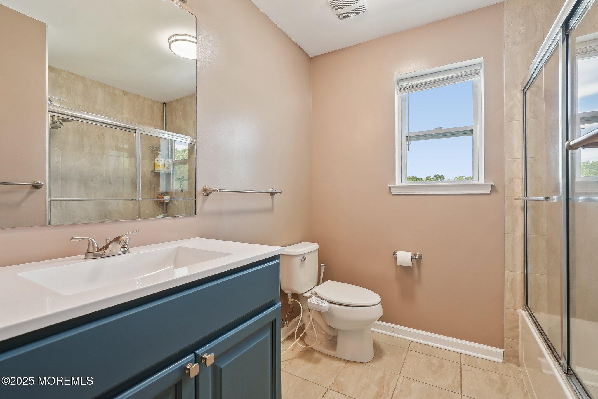 4 Bridle Path Bayville, NJ 08721 - Photo 25 of 44 a bathroom with a sink a toilet and shower