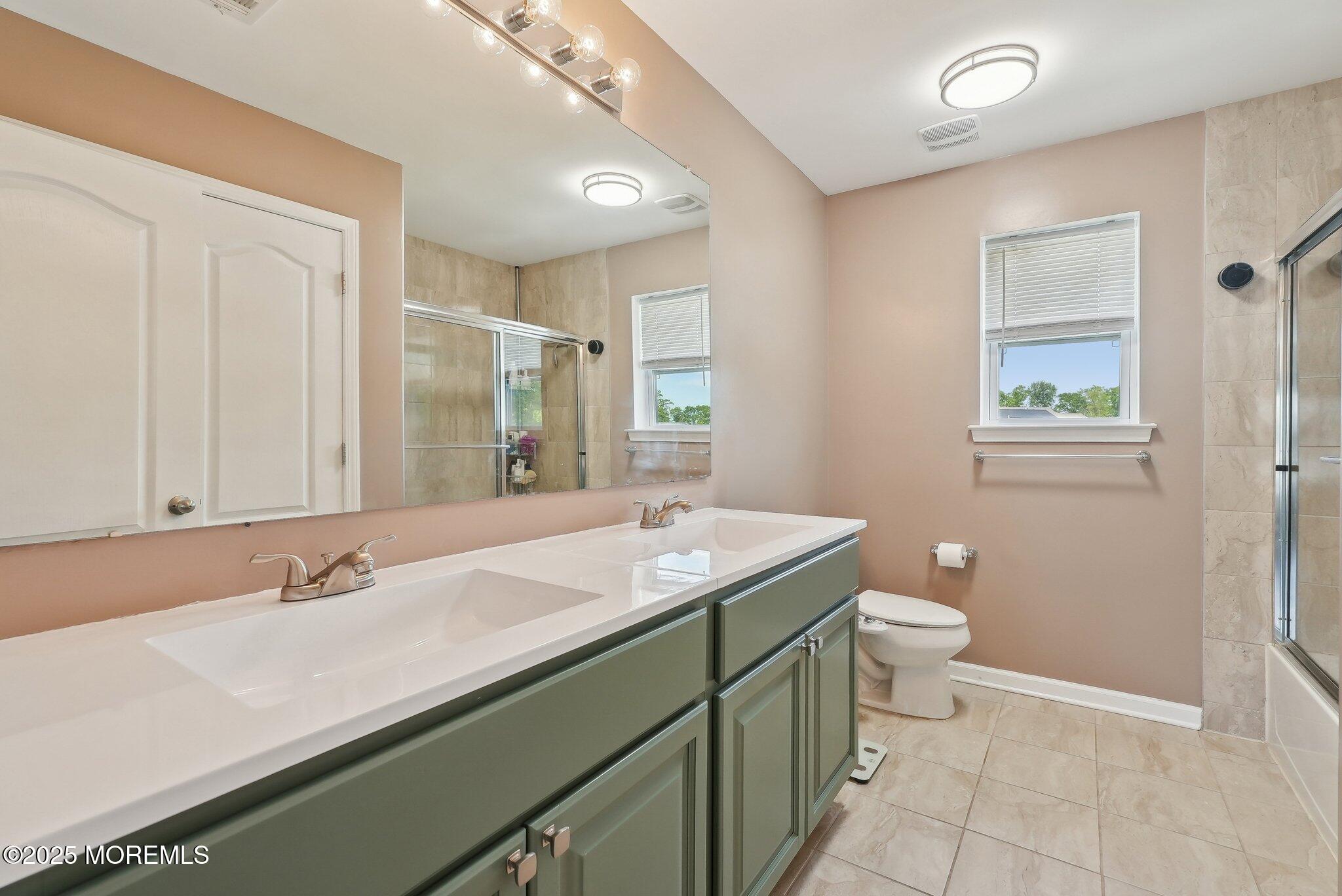 4 Bridle Path Bayville, NJ 08721 - Photo 27 of 44 a bathroom with a granite countertop sink a toilet and a mirror