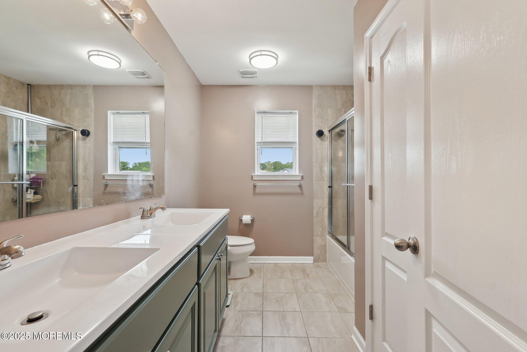 4 Bridle Path Bayville, NJ 08721 - Photo 28 of 44 a bathroom with a sink and a mirror
