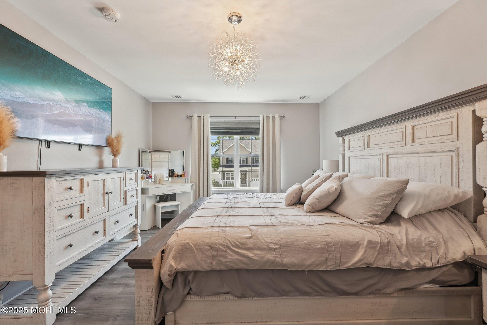 4 Bridle Path Bayville, NJ 08721 - Photo 30 of 44 a bedroom with a large bed and a window