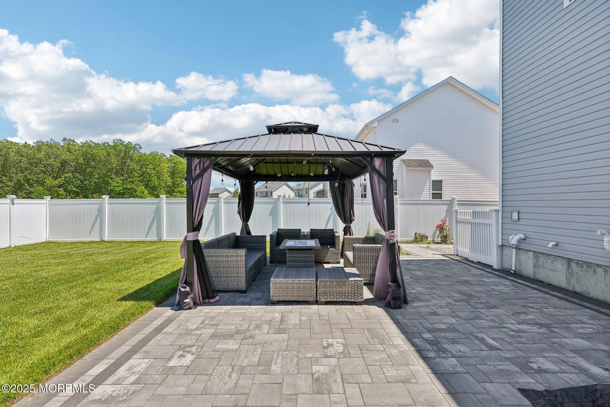 4 Bridle Path Bayville, NJ 08721 - Photo 40 of 44 a view of a patio with table and chairs and potted plants