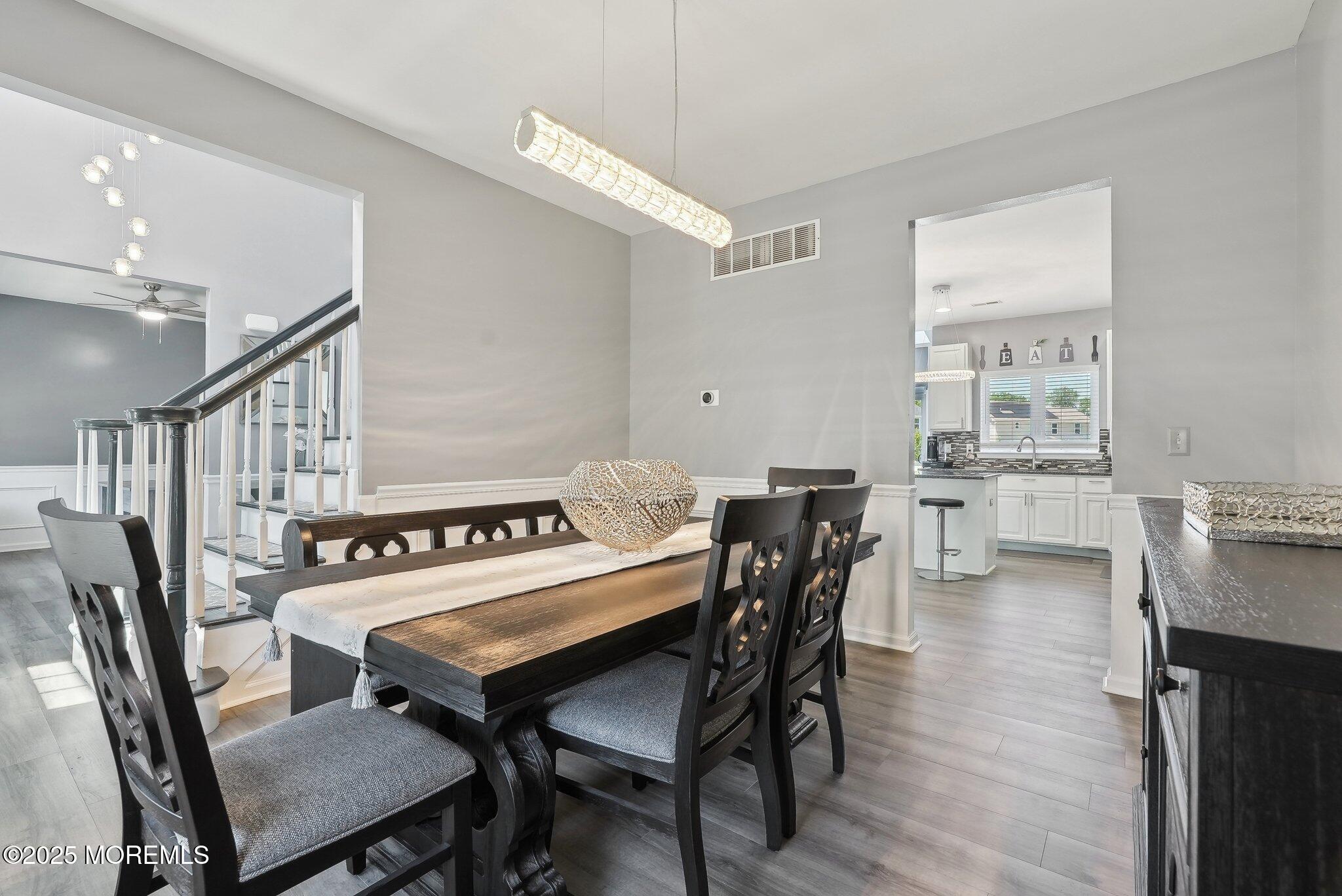 4 Bridle Path Bayville, NJ 08721 - Photo 10 of 44 a view of a dining room with furniture and wooden floor