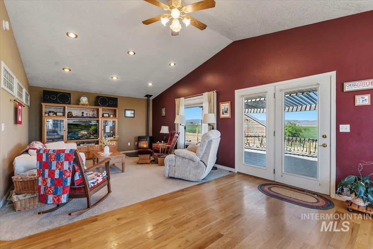 2331 Gulley Road Homedale, ID 83628 - Photo 6 of 46 Living area featuring wood-finish flooring, vaulted ceilings, recessed lighting, and a ceiling fan