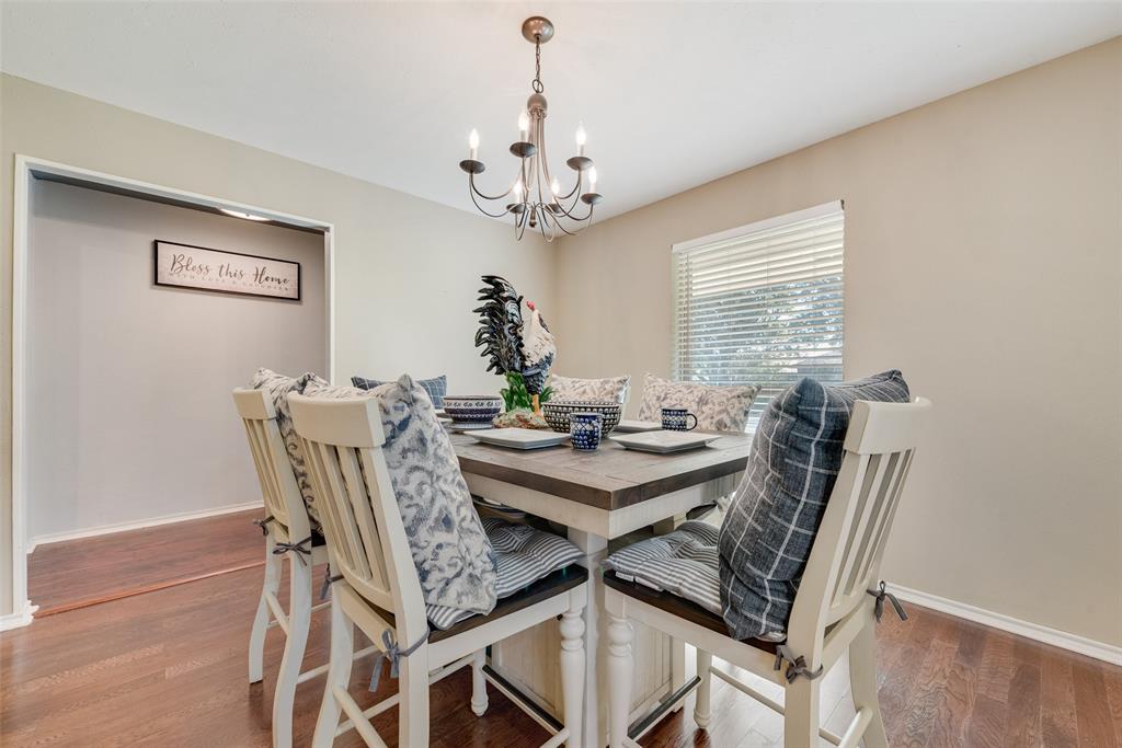 1923 Baylor Drive Richardson, TX 75081 - Photo 14 of 39 a view of a dining room with furniture window and wooden floor