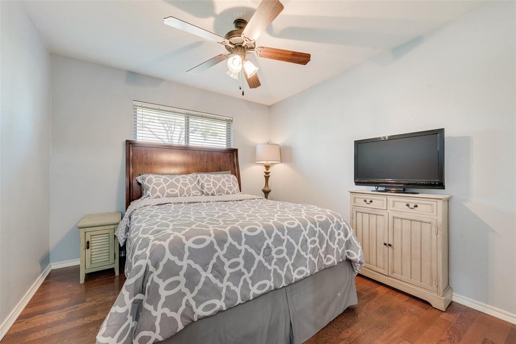 1923 Baylor Drive Richardson, TX 75081 - Photo 32 of 39 a bedroom with a bed and a flat screen tv