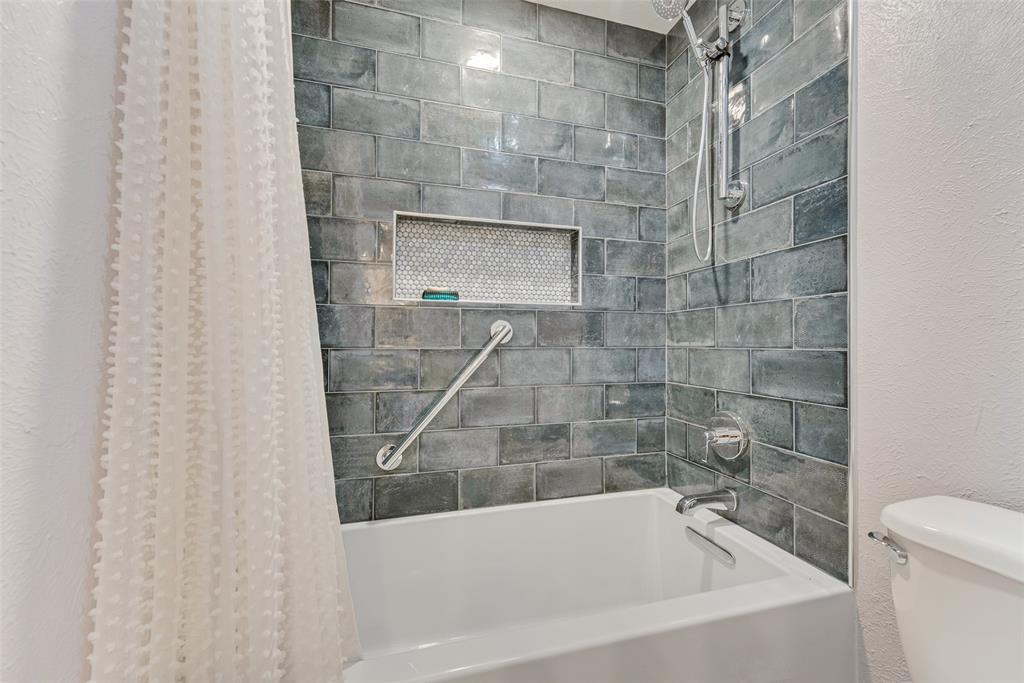 1923 Baylor Drive Richardson, TX 75081 - Photo 34 of 39 a bathroom with a bathtub