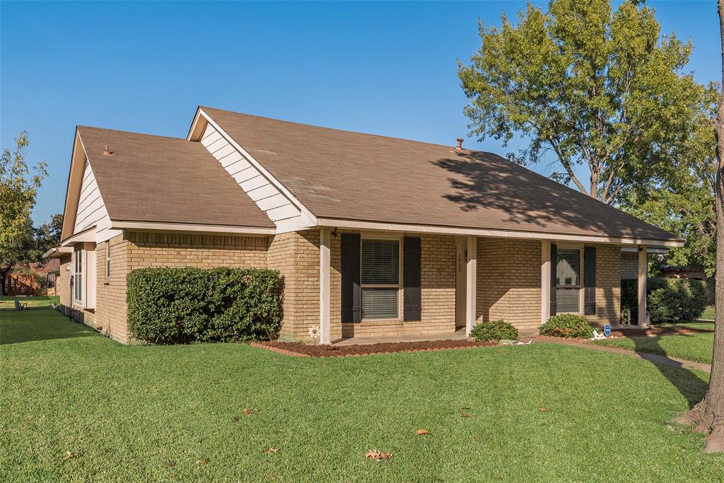 1923 Baylor Drive Richardson, TX 75081 - Photo 5 of 39 front view of a house with a yard