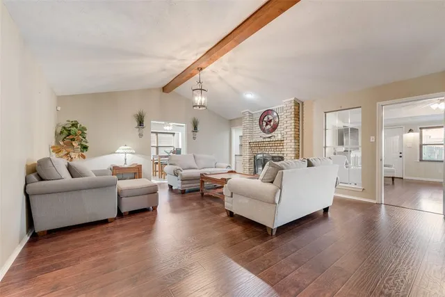 a living room with furniture or couch and a wooden floor