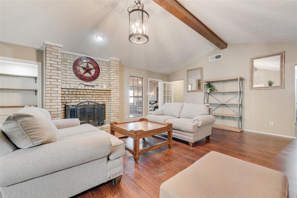 1923 Baylor Drive Richardson, TX 75081 - Photo 9 of 39 a living room with furniture and a fireplace
