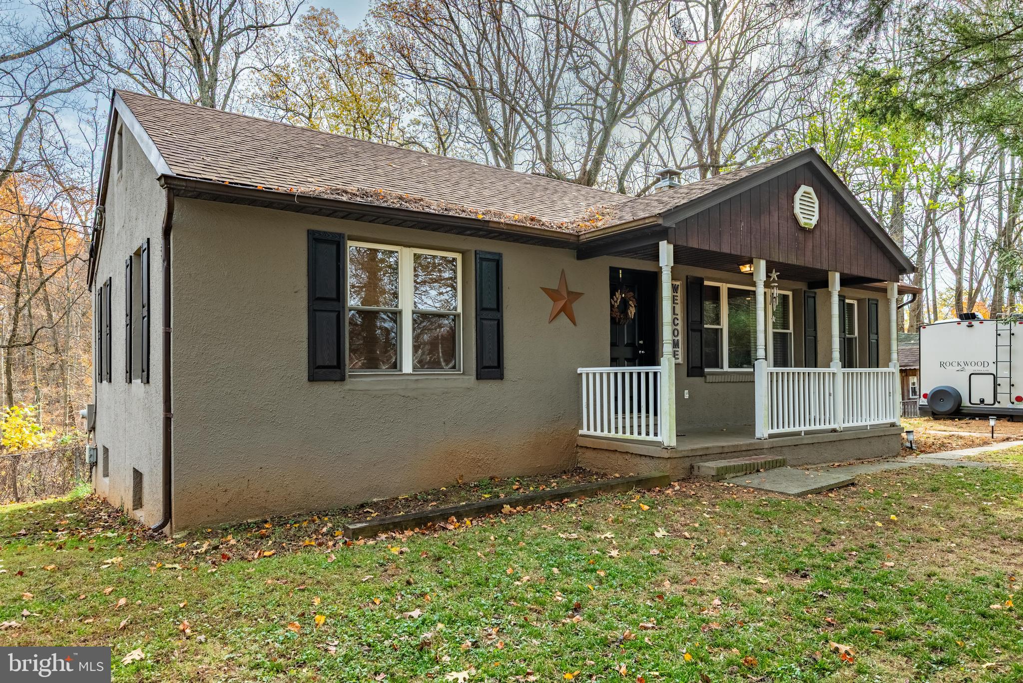 211 East Wheel Road Abingdon, MD 21009 - Photo 2 of 27 a front view of a house with garden