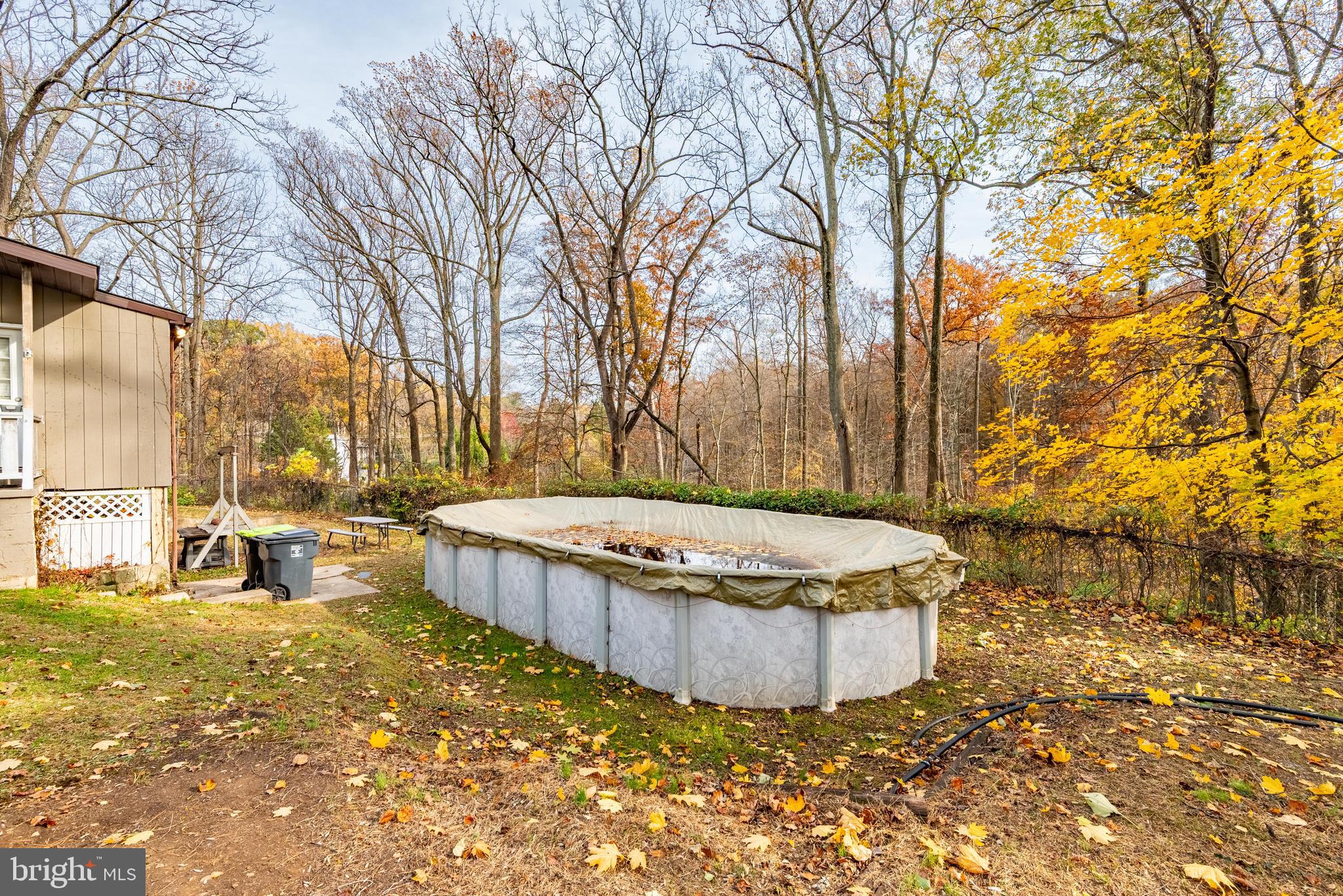 211 East Wheel Road Abingdon, MD 21009 - Photo 24 of 27 a view of a backyard with large tree and wooden fence