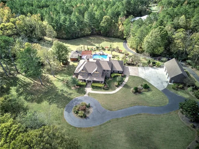 an aerial view of a house with outdoor space