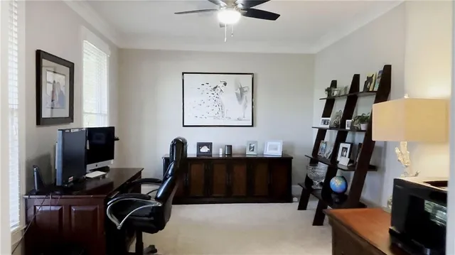 a living room with furniture kitchen and a chandelier