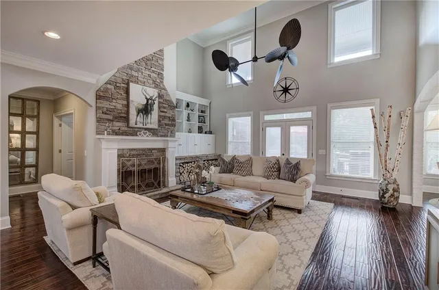 a living room with furniture fireplace and flat screen tv