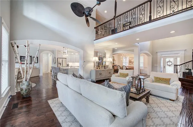 a spacious bathroom with a double vanity sink a mirror a shower and a bathtub
