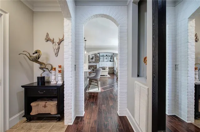 a bathroom with a granite countertop sink a mirror and a shower