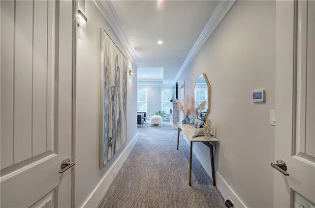 a bedroom with a bed and hallway