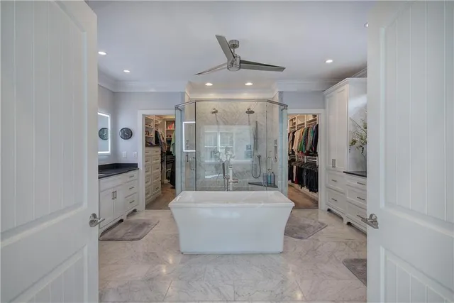 a view of a patio with couches chairs and a potted plant