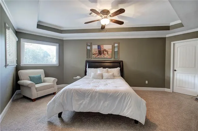 an aerial view of a house with yard swimming pool and outdoor seating