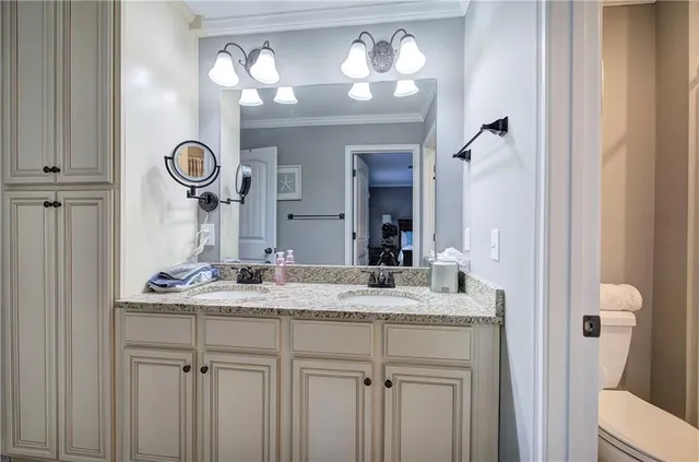 an aerial view of a house with a yard and large trees