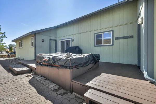 a view of a dry yard with a tree