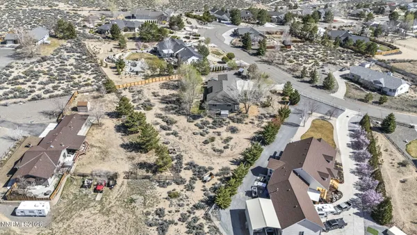 a room with stainless steel appliances kitchen island a table and chairs in it