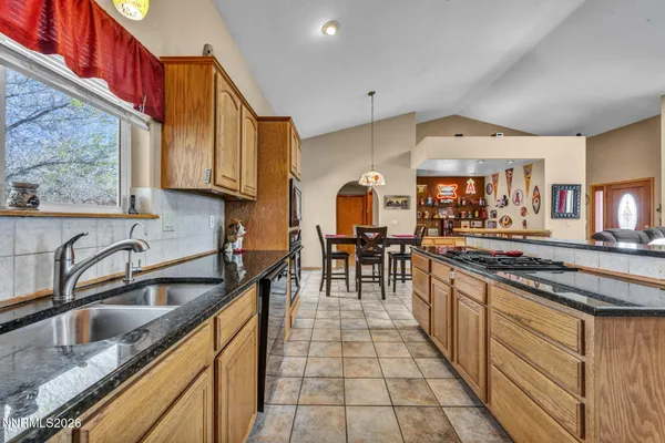 a en suite bathroom with a sink double vanity and a mirror