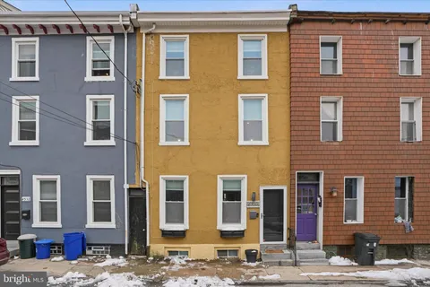 a front view of a building with a street