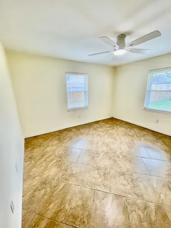 an empty room with a empty space and a window