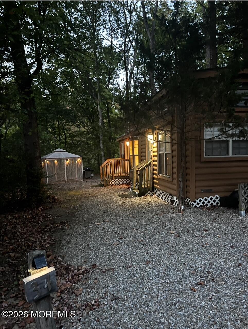 724 Monmouth Road, Unit 34 Cream Ridge, NJ 08514 - Photo 12 of 18 a view of a house with a yard and large tree