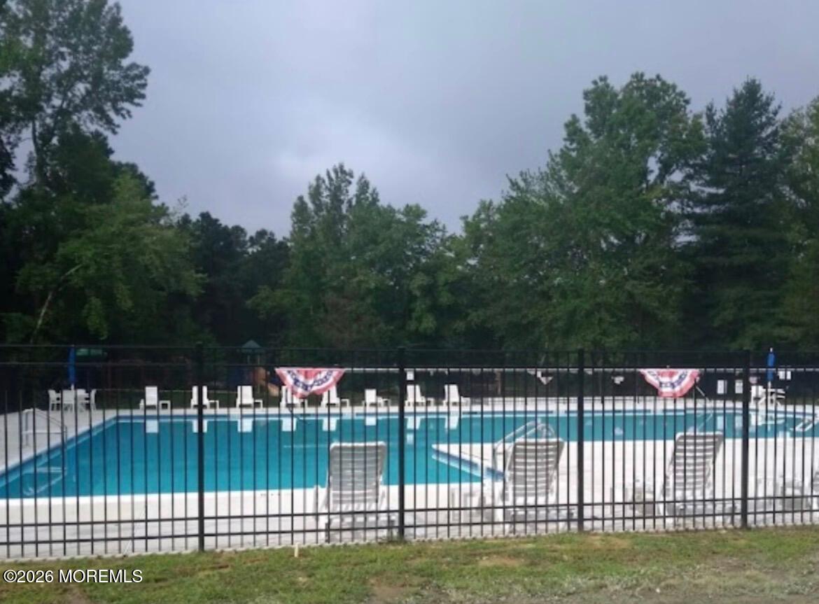 724 Monmouth Road, Unit 34 Cream Ridge, NJ 08514 - Photo 14 of 18 a view of house with a fence