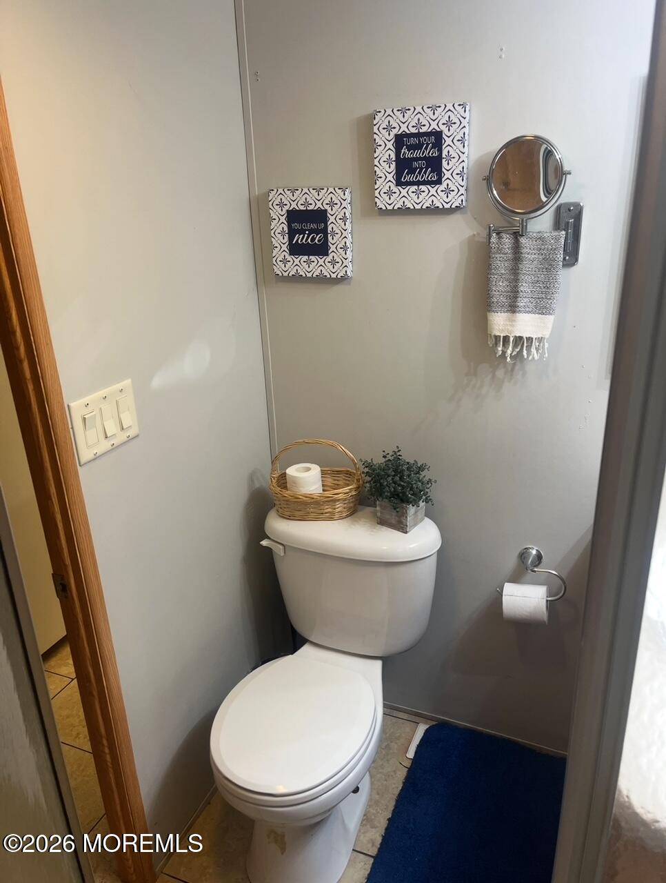 724 Monmouth Road, Unit 34 Cream Ridge, NJ 08514 - Photo 7 of 18 a white toilet sitting next to a sink