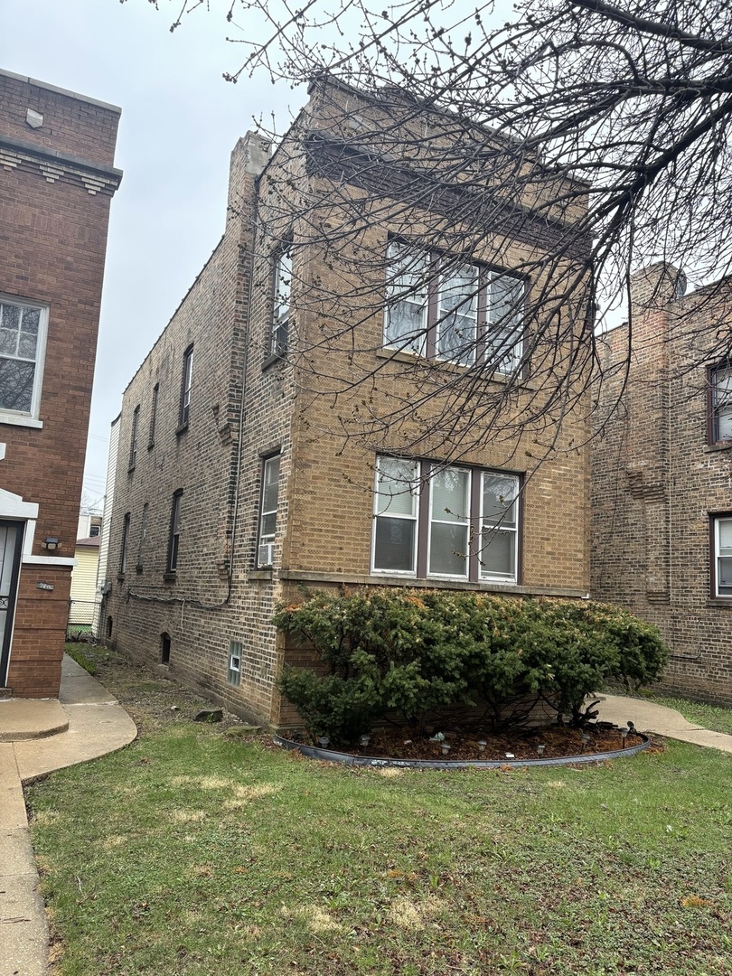 1711 North Austin Avenue Chicago, IL 60639 - Photo 2 of 13 a view of a house with backyard and garden
