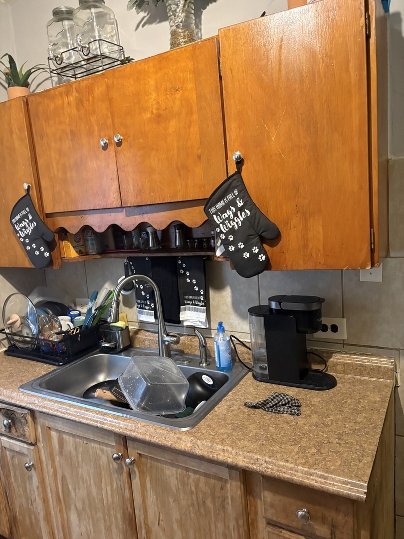 1711 North Austin Avenue Chicago, IL 60639 - Photo 8 of 13 a kitchen with a sink a stove and refrigerator