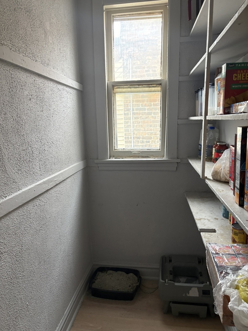 1711 North Austin Avenue Chicago, IL 60639 - Photo 9 of 13 a room with storage and utility