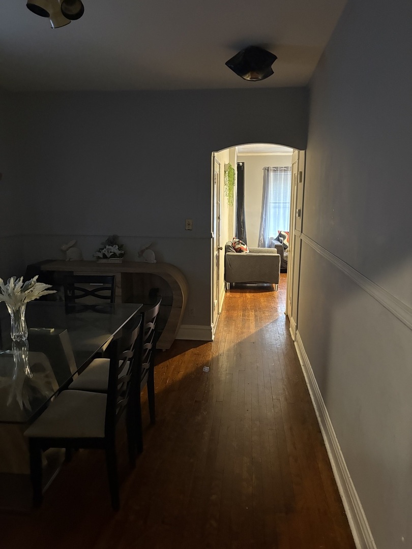1711 North Austin Avenue Chicago, IL 60639 - Photo 10 of 13 a view of a room with furniture and wooden floor