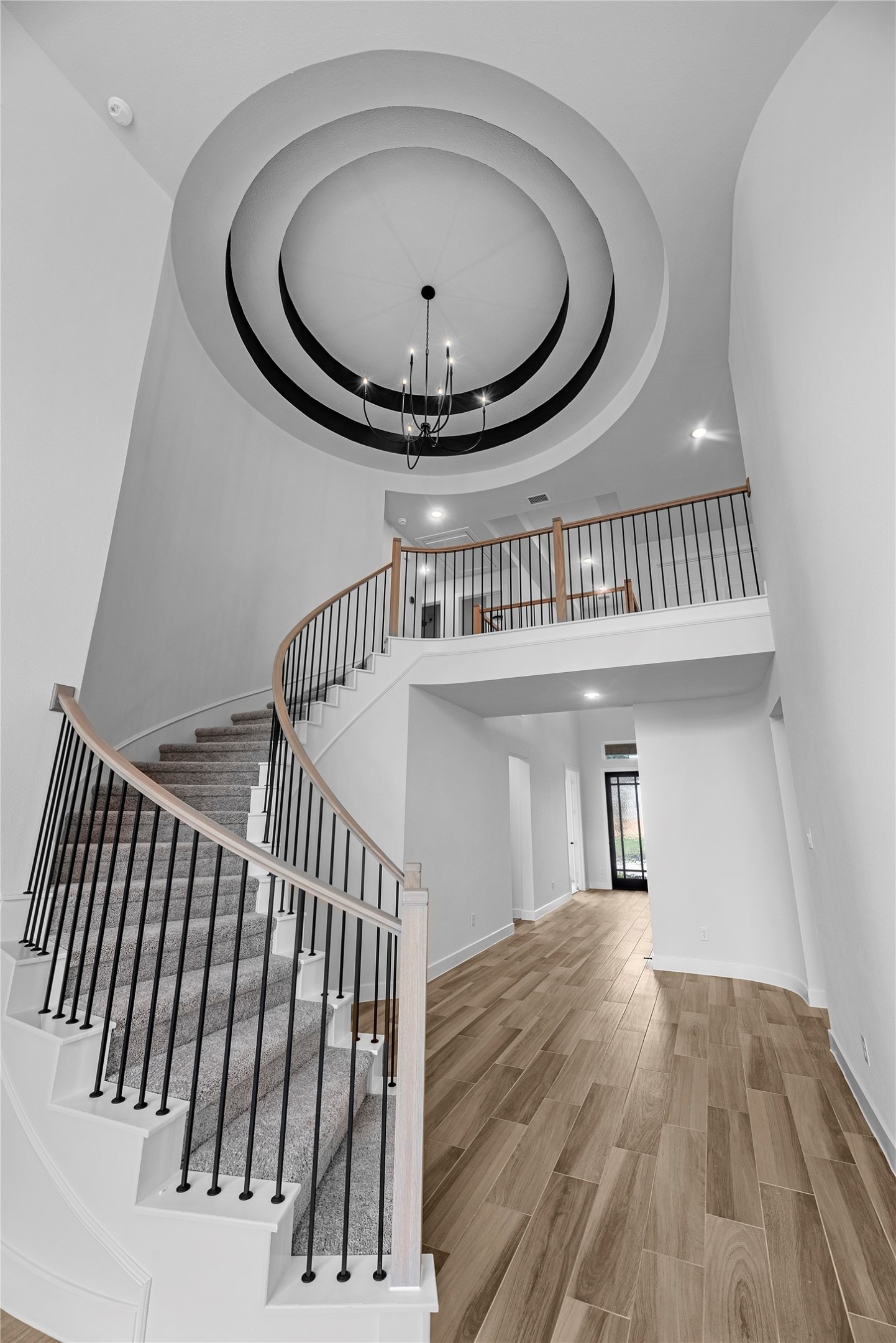 615 Roland Lane Rosenberg, TX 77471 - Photo 2 of 26 a view of staircase with wooden floor and a sink