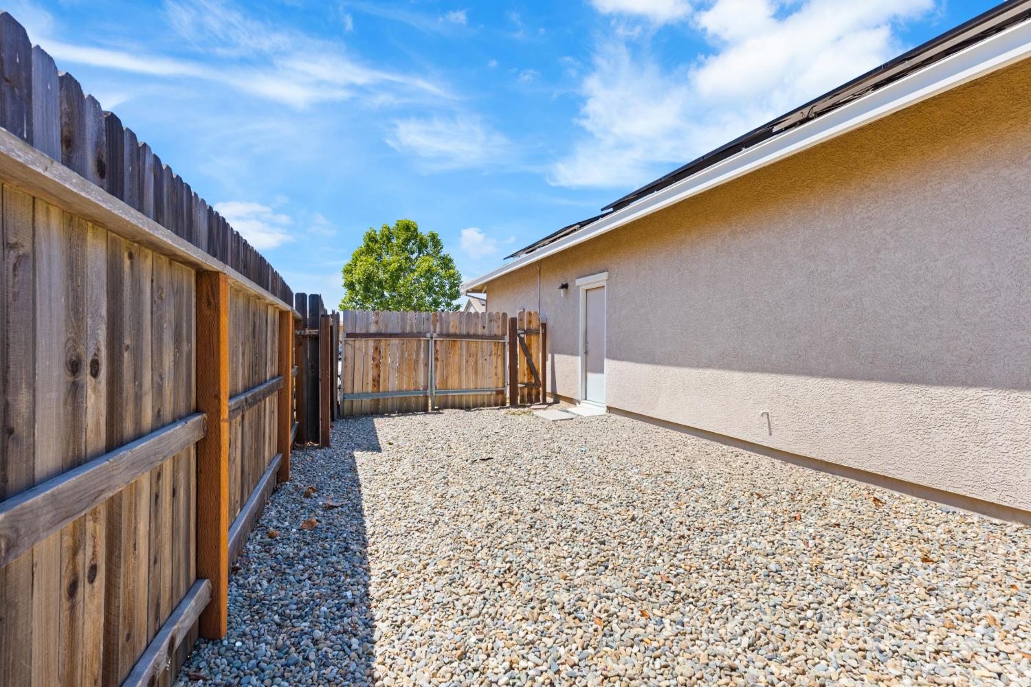 2011 Roy Ranch Way Plumas Lake, CA 95961 - Photo 45 of 49 a view of a house with wooden fence