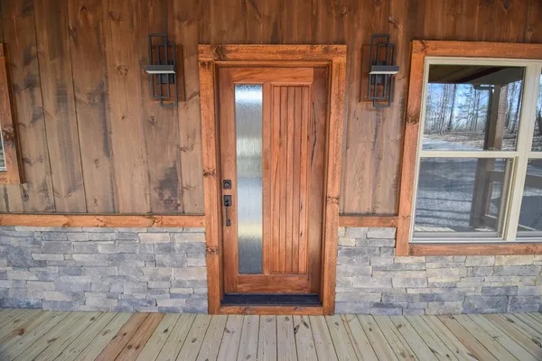 a view of front door with wooden floor