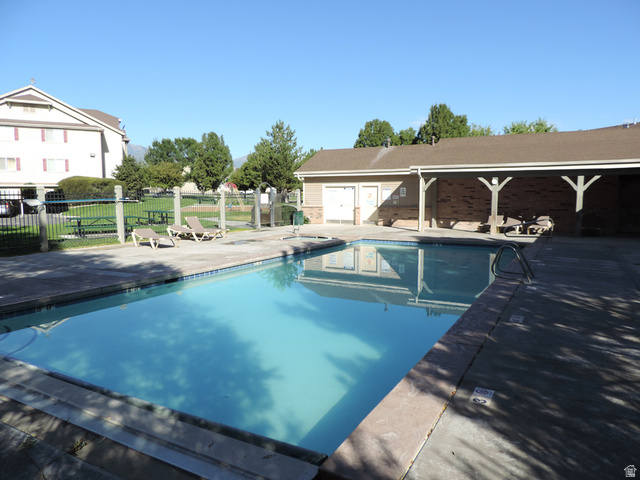 8198 North Cedar Springs Road, Unit 5 Eagle Mountain, UT 84005 - Photo 27 of 30 Community pool featuring a patio