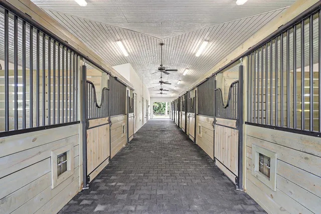 a view of a hallway with stairs