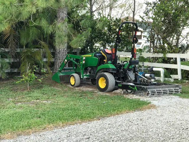 a view of a park with iron fence