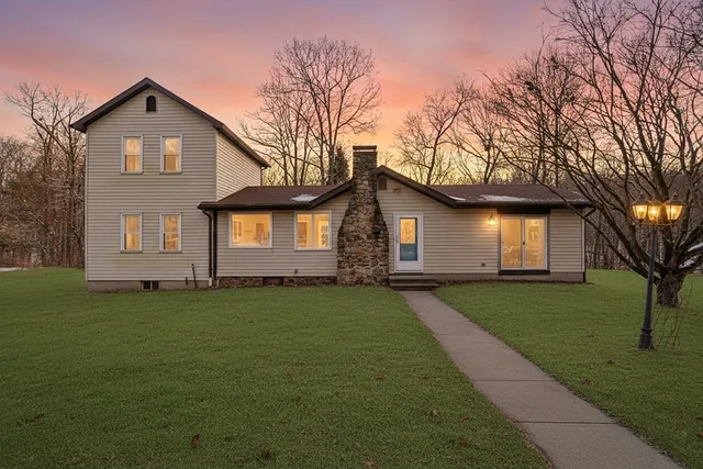a front view of a house with a yard