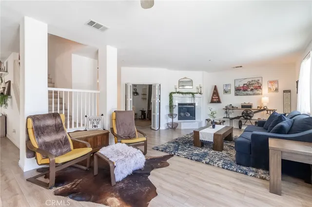 a living room with furniture or couch and a wooden floor