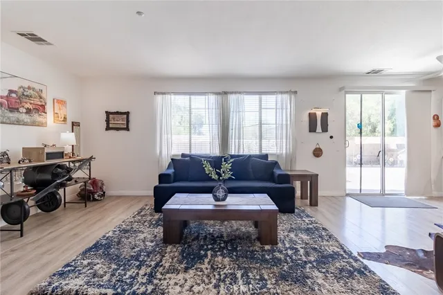 a living room with furniture and a rug