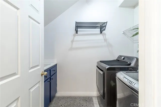 a utility room with washer and dryer