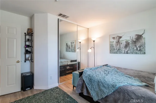 a bedroom with a bed and a view of bathroom