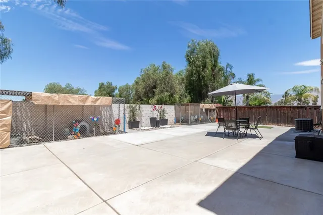 a view of a backyard with sitting area