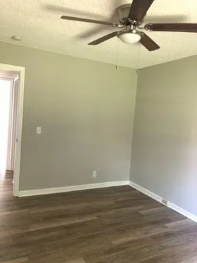 a view of a small space with wooden floor