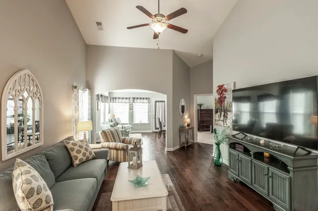 a living room with furniture and a large window